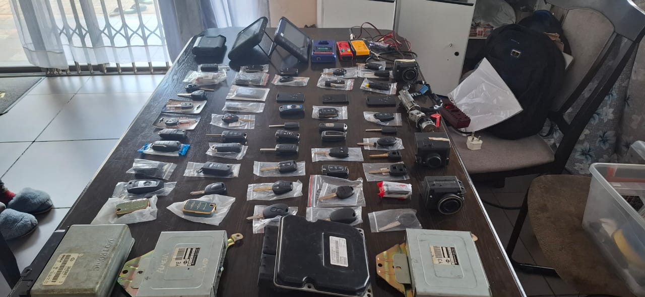 Key cutting and coding machine